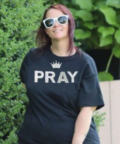 A woman wearing an oversized black tee