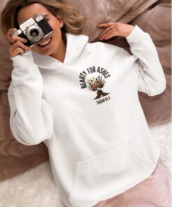 Person in "Beauty for Ashes" hoodie with camera