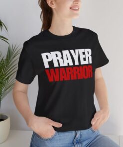 Person wearing "PRAYER WARRIOR" T-shirt