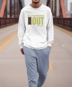 Person walking on bridge wearing inspirational sweatshirt