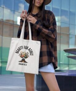 Woman holding "Beauty for Ashes" tote bag
