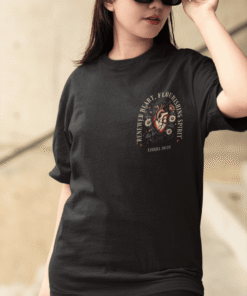 Woman wearing black graphic t-shirt and red cap
